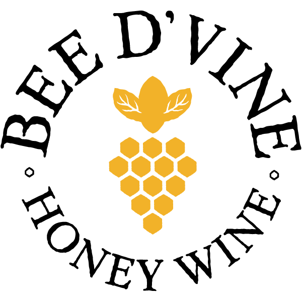 Round company logo Inner part showing comb and bee in yellow and the outer part of the circle is written 