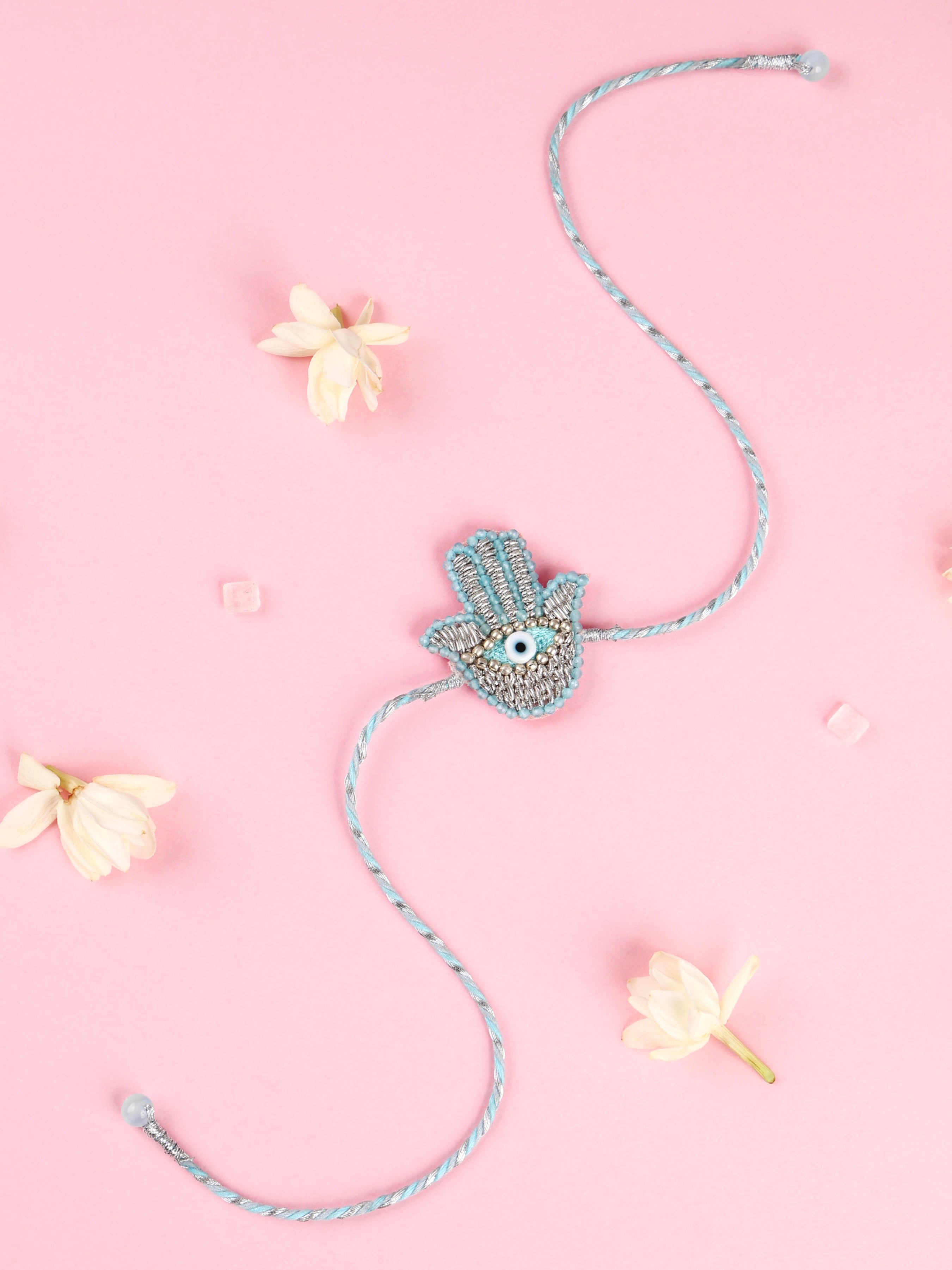 tonoto-pastel-blue-hamsa-brother-rakhi